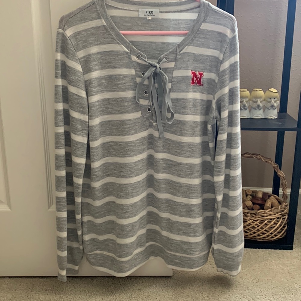 Very cute Nebraska Huskers fan pullover. Size L. Small logo on the front